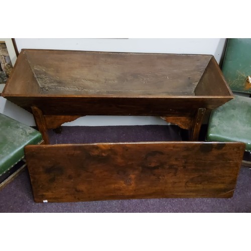 74 - An early 19th century elm and fruitwood dough bin, rounded rectangular top, chipped carved edges, ca... 