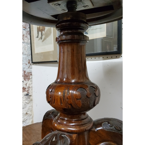 96 - A William IV walnut piano stool, tapestry seat, turned column with trio of acanthus capped outswept ... 