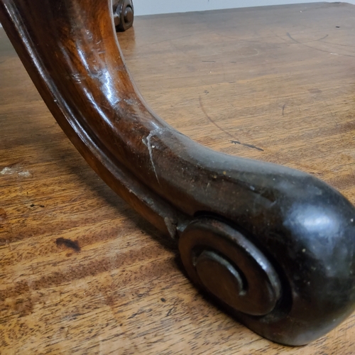 96 - A William IV walnut piano stool, tapestry seat, turned column with trio of acanthus capped outswept ... 