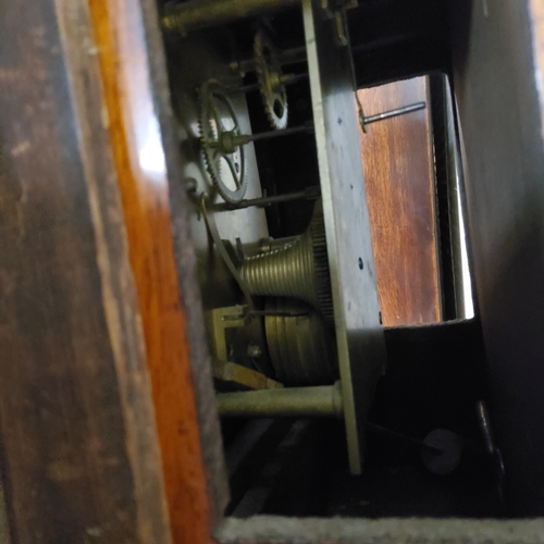 100 - A Victorian mahogany fusee school clock, Roman numerals, 42cm diameter.