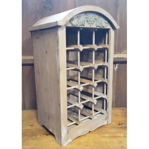 155 - A contemporary limed softwood 15 bottle wine rack, domed top, 63cm high, 39cm wide