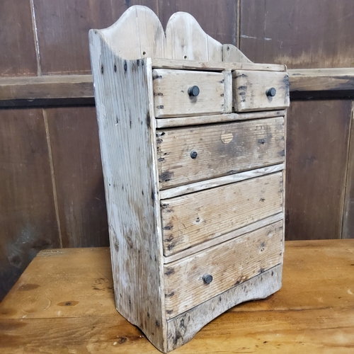 157 - A rustic 19th century farmhouse pine spice rack of two above three drawers c.1880