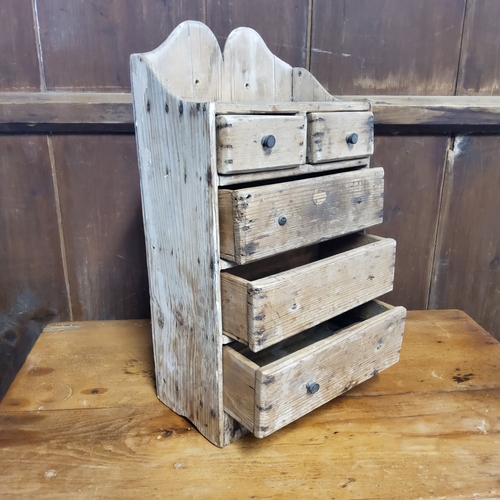 157 - A rustic 19th century farmhouse pine spice rack of two above three drawers c.1880