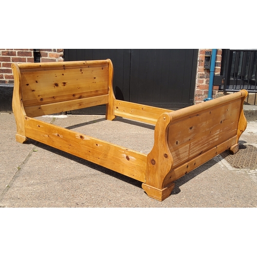 169 - A Farmhouse pine double sleigh bed