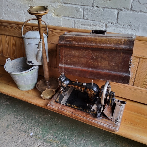 172 - A Kildare sewing machine, cased;   an oak smoker's stand, 63cm high, c.1930;   a galvanised water ca... 