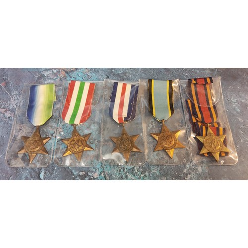 197 - A collection of five WWII Second World War campaign medals including The Atlantic Star, The Italy St... 