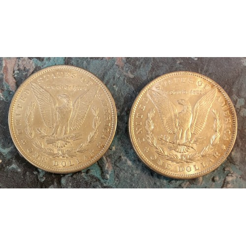 214 - An 1885 American One Dollar; another 1887 (2)