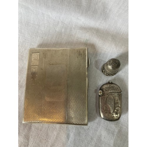 239 - A silver cigarette case, engine turned, 8cm high, Birmingham 1937;  a silver vesta case, Birmin... 