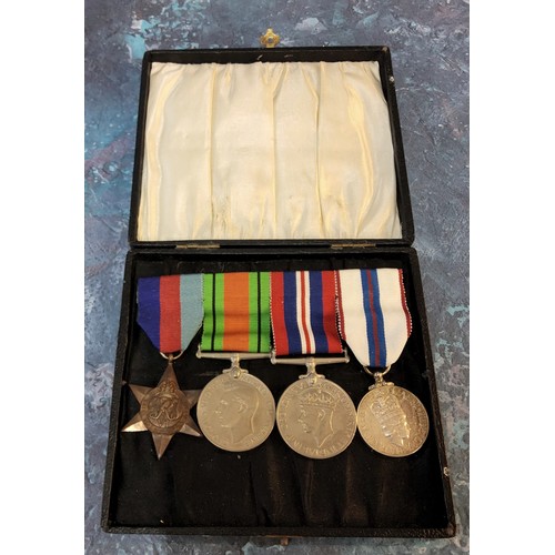 195 - A WWII medal trio including George VI 1939-45 star, defence and service medal, unattributed, an Eliz... 