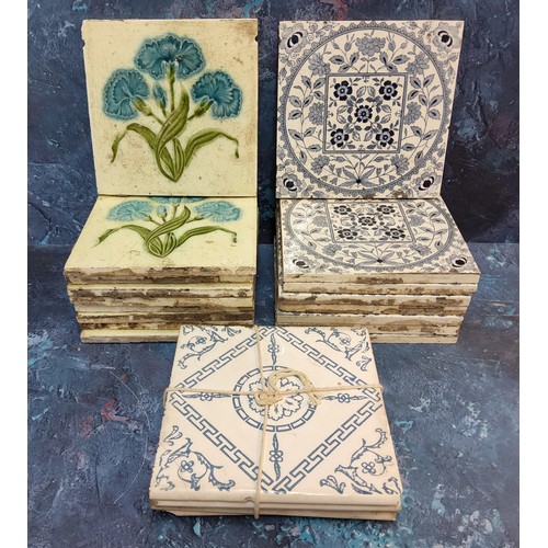 309 - A set of eight H & RJ tiles, tube lined with cornflowers,in olive and blue,  15.65cm square... 