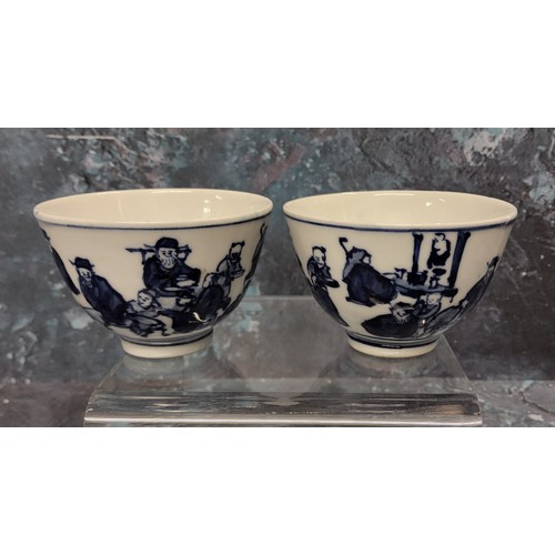 347 - Two Chinese  wine bowls, decorated in blue with figures in various poses, 6.5cm diam, four char... 