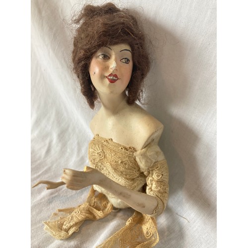 358 - An early 20th century German Boudoir half doll, brown wig, open mouth, 15cm high, triangle mark