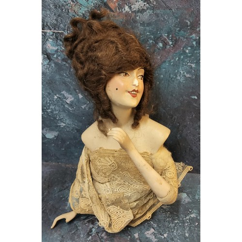 358 - An early 20th century German Boudoir half doll, brown wig, open mouth, 15cm high, triangle mark