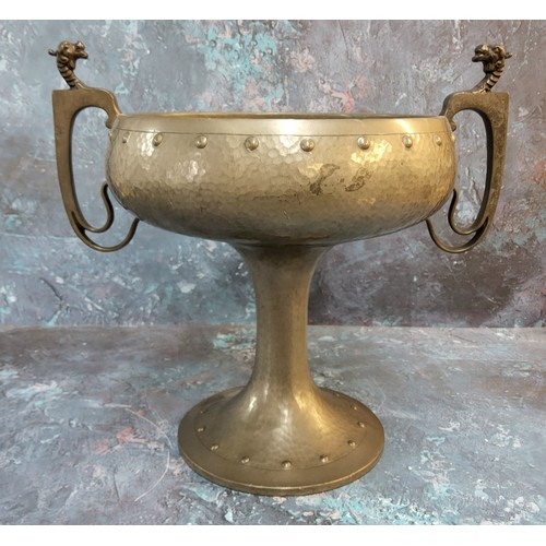 363 - An Art Nouveau style twin handle pedestal bowl, hand plenished, the two handles mounted with dragon ... 