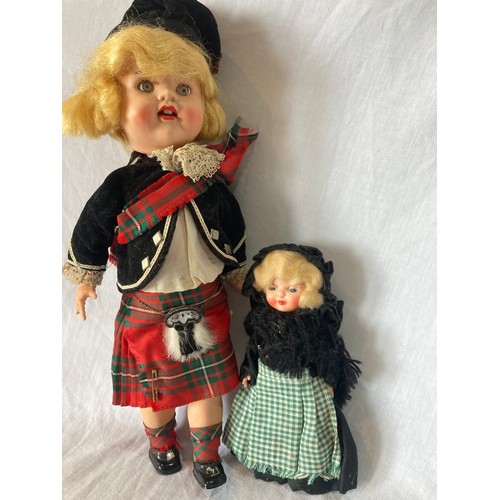 375 - A Roddy hard plastic walking doll, in Scottish dress, 30cm high, c.1950;  a Rosebud costume dol... 