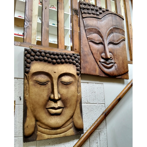 385 - Two large Indonesian Bhudda panels, one carved from three panels of hardwood, the other resin (2)