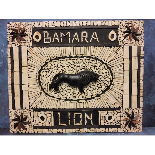 389 - An unusual bone mosaic wooded panel, Bamara Lion, centred with lion standing, 60cm x 50cm