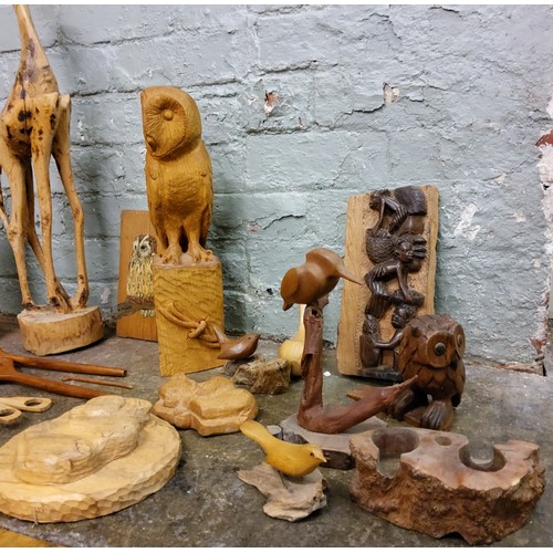 445 - An African native wood bust, of an elder;  other native carvings;  an owl;  etc