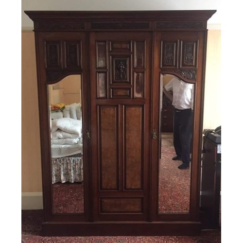 153A - A Victorian burr walnut and mahogany double wardrobe, the oversailing cornice above central blind do... 