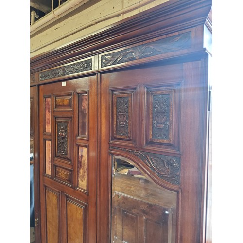 153A - A Victorian burr walnut and mahogany double wardrobe, the oversailing cornice above central blind do... 