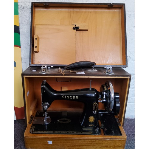 518 - A Singer sewing machine, cased