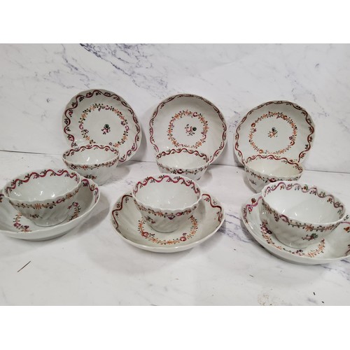 2 - A set of six Newhall tea bowl and saucers, wrythen moulded, decorated in famille rose with stylised ... 