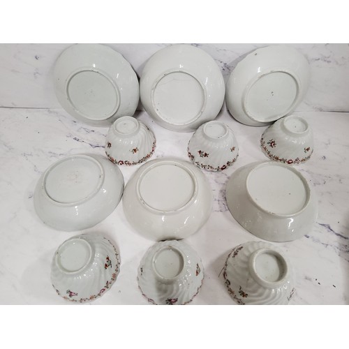 2 - A set of six Newhall tea bowl and saucers, wrythen moulded, decorated in famille rose with stylised ... 