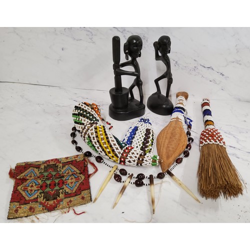 44 - African Art - ebonised figures;  beadwork brush, horn and and spear;  a porcupine and bead necklace;... 