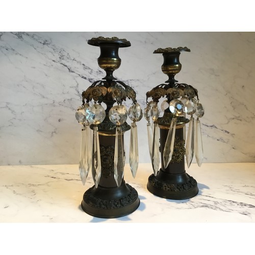 56 - A pair of Regency bronze candle lustres, cast with stylised leaves, clear glass prismatic droplets, ... 