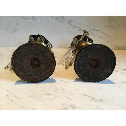 56 - A pair of Regency bronze candle lustres, cast with stylised leaves, clear glass prismatic droplets, ... 