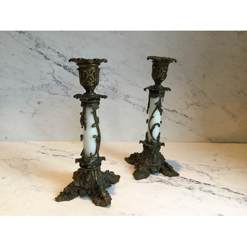 71 - A pair of 19th century French bronze and opaque glass candlesticks, foliate cast sconces, white glas... 