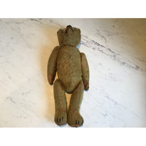 88 - An early 20th century jointed mohair bear, horizontal stitched snout, button eyes, 42cm high, c.1910