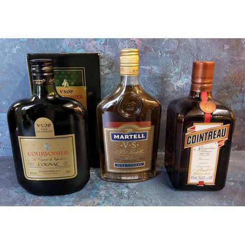 23 - A Courvoisier Fine Champagne VSOP cognac, boxed; a Martell VS fine cognac; a 0,70l bottle of Cointre... 