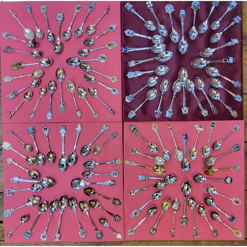 205 - A collection of spoons arranged on four trays, mainly Yorkshire & American examples