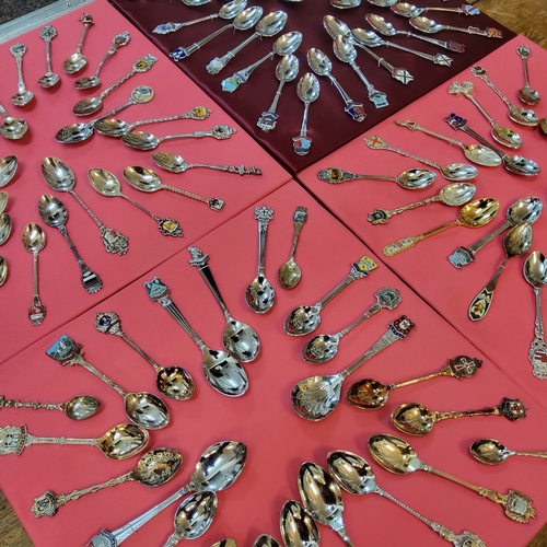 205 - A collection of spoons arranged on four trays, mainly Yorkshire & American examples