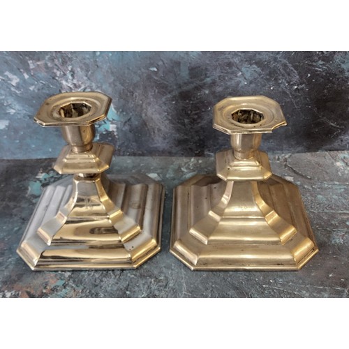 240 - A pair of Continental silver coloured metal  candlesticks, canted sqare sconces, spreading base... 