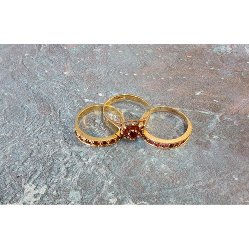 252 - A 9ct gold half eternity ring set with ten round rubies, size O; another set with seven rubies, size... 