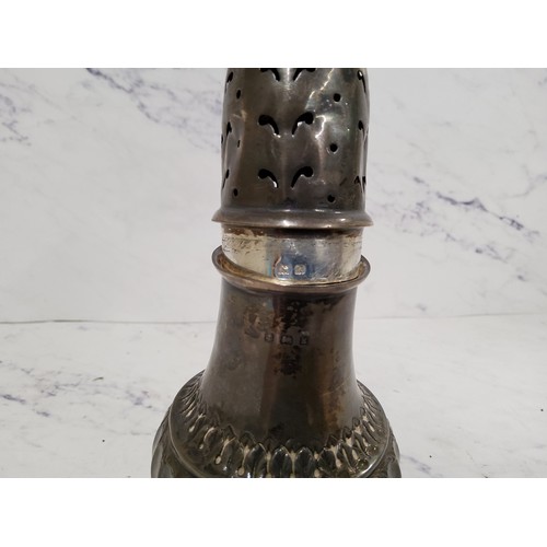 282 - A silver baluster sugar caster, fluted base, lofty domed pierced cover, 17.5cm high, Birmingham 1910... 