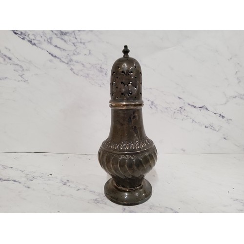 282 - A silver baluster sugar caster, fluted base, lofty domed pierced cover, 17.5cm high, Birmingham 1910... 