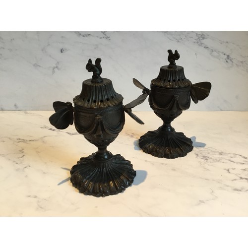 288 - A pair of Regency bronze pastille burners and covers, of pedestal form, butterfly handles, the bases... 