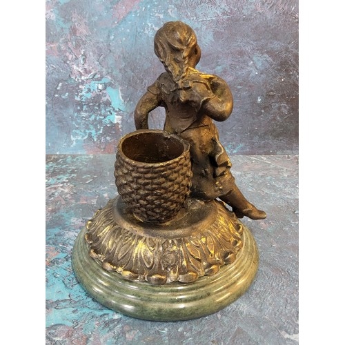 293 - A late Victorian bronze matchstick/spill holder in the form of a young girl sat before a wicker bask... 