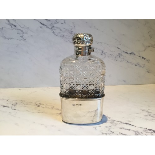 299 - A silver and hobnail cut glass hip flask, detachable cup, hinged domed cover, embossed with scrolls,... 