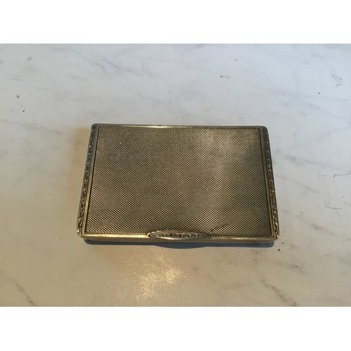 300 - A George V silver rectangular card case, engine turned, gilt interior, 7cm wide, Birmingham 1930