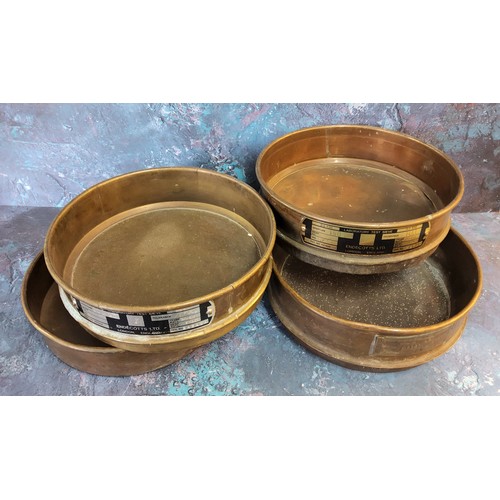 329 - Three copper testing sieves N. Greenings & Sons and Endecotts Ltd and base