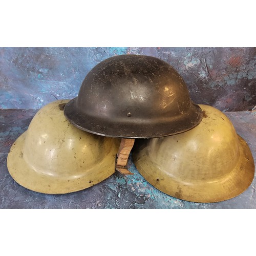 123 - A World War II Plasfort helmet;  others, tin (3)