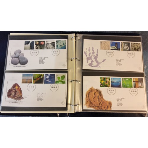 345 - A Queen Elizabeth II Royal Mail Millennium Collection album, containing mint presentation packs from... 