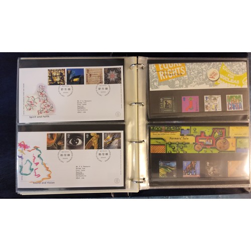 345 - A Queen Elizabeth II Royal Mail Millennium Collection album, containing mint presentation packs from... 