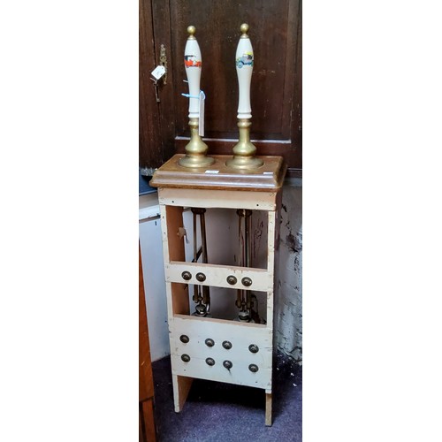 495 - An 20th century beer pump, holding two ceramic pulls, complete with workings in a wooden housing, 14... 