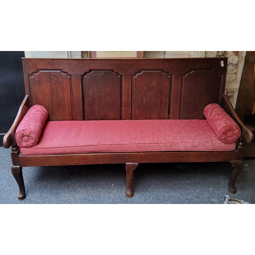 478 - An 18th century oak settle, rectangular back with four  arched raised and fielded panels, shaped arm... 