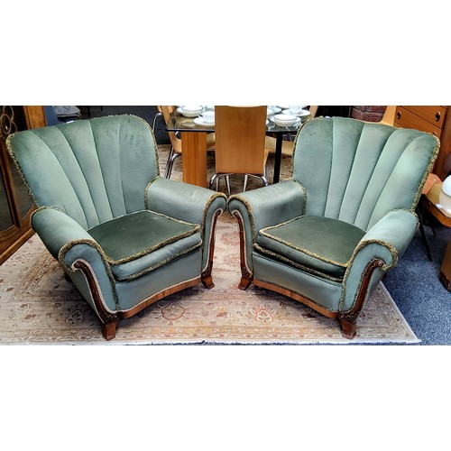 505 - A pair of Art Deco walnut emerald green shell back club chairs c.1930